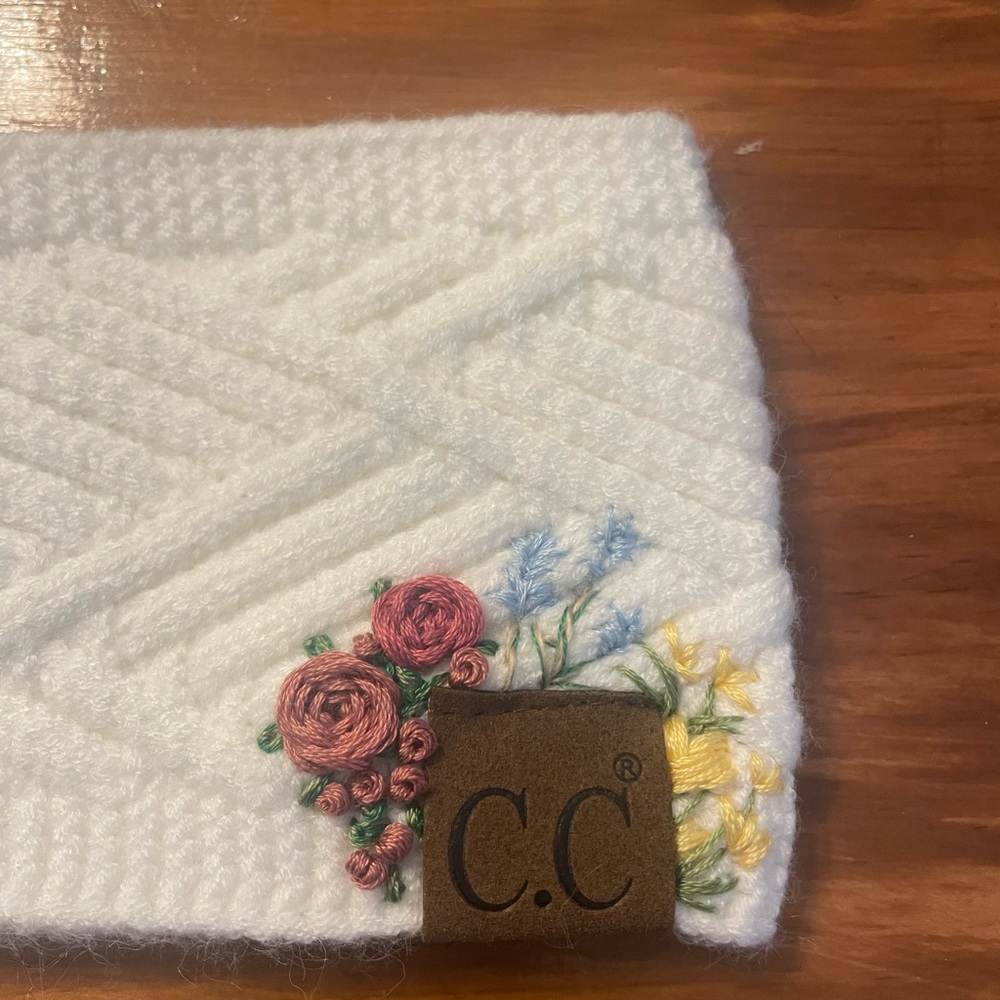 Floral hand embroidered C.C. headband. New with tags.